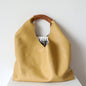 Leather bag with woven handle