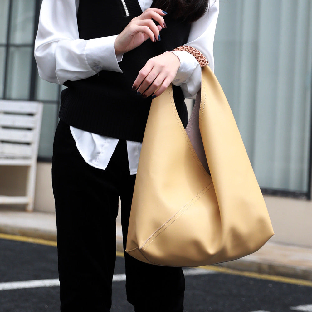 Leather bag with woven handle