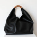 Leather bag with woven handle