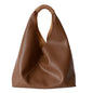 Leather bag with woven handle