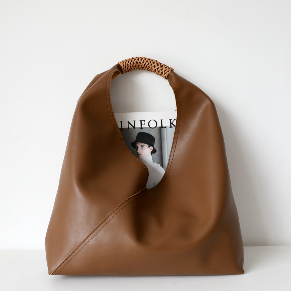 Leather bag with woven handle