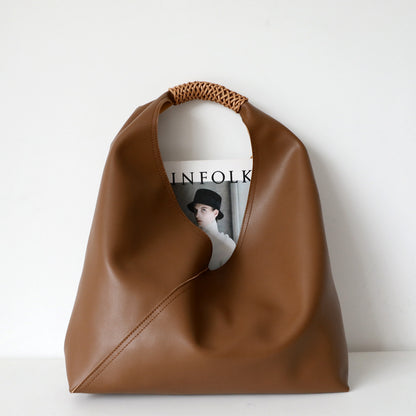 Leather bag with woven handle